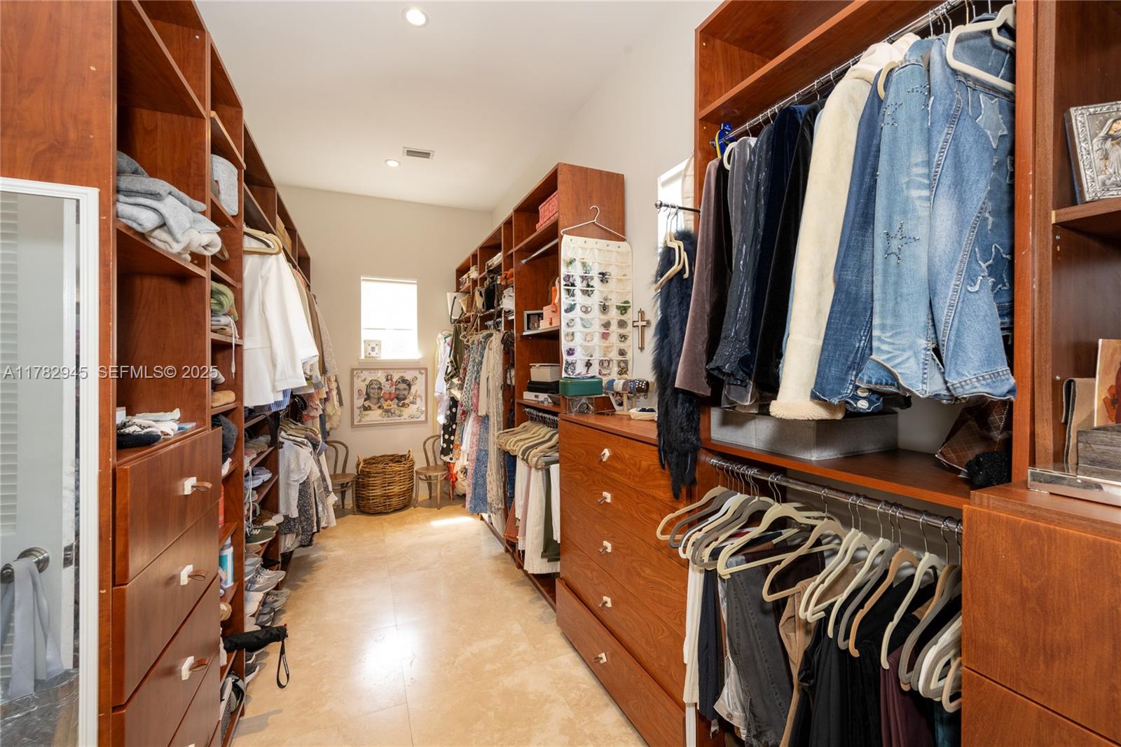 31 Island Drive Key Biscayne, FL 33149 - Photo 23 of 26 a view of walk in closet with clothes and shoes