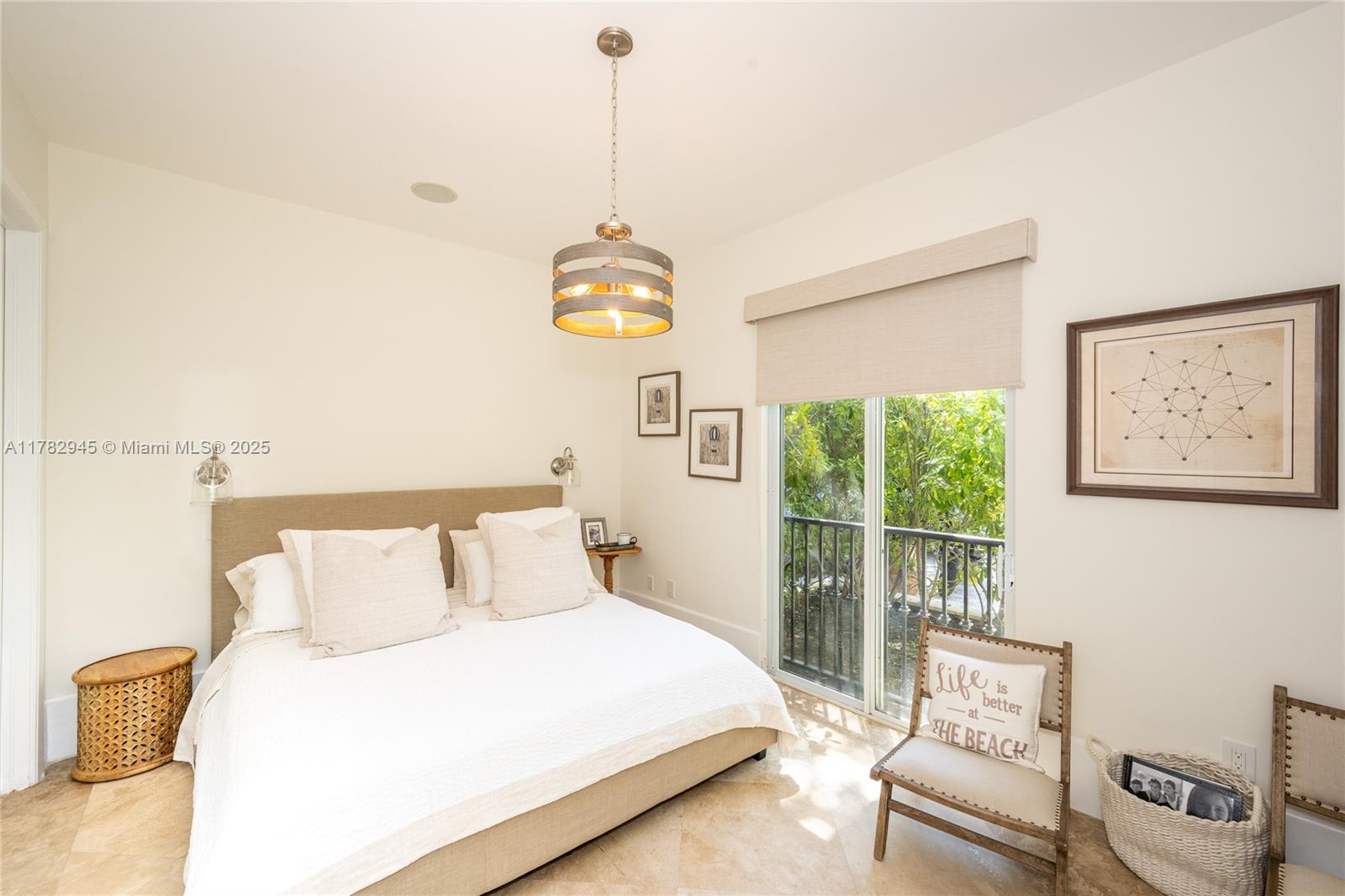 31 Island Drive Key Biscayne, FL 33149 - Photo 24 of 26 a bedroom with a bed and a window