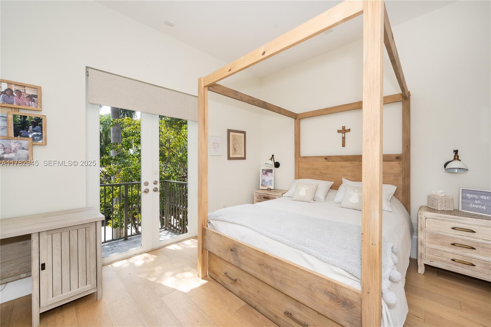 31 Island Drive Key Biscayne, FL 33149 - Photo 26 of 26 a bedroom with a bed and a dresser with wooden floor