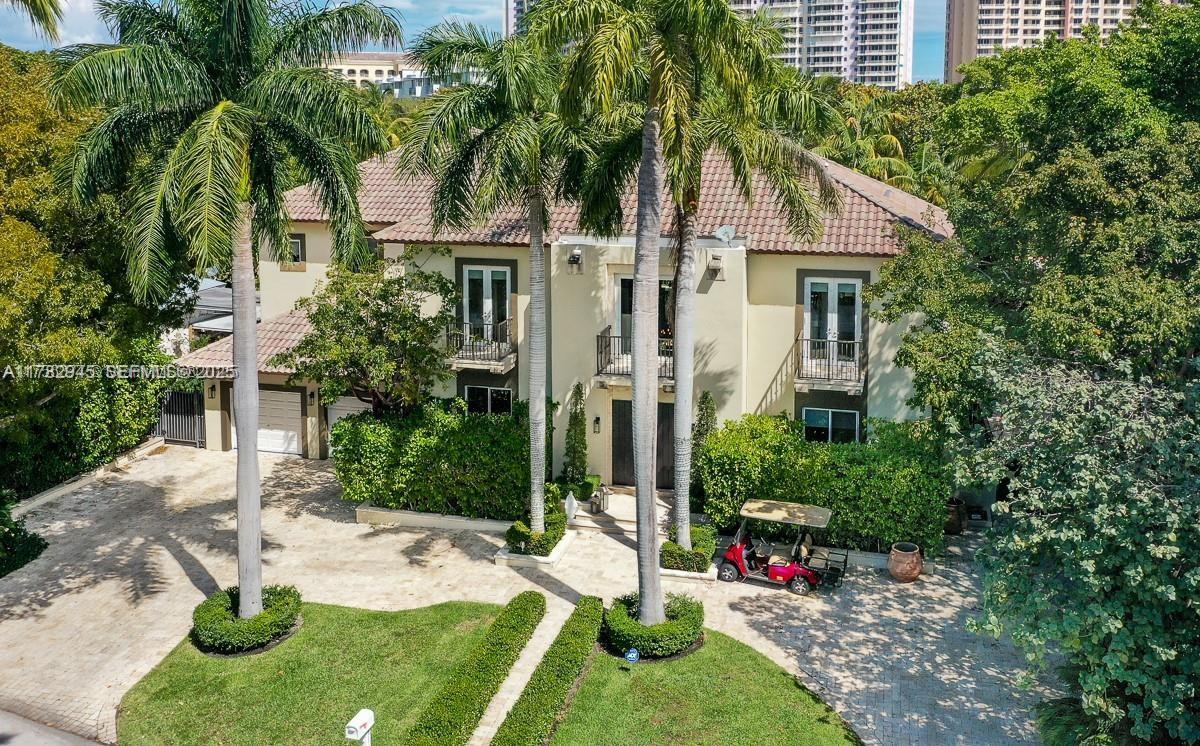 31 Island Drive Key Biscayne, FL 33149 - Photo 3 of 26 a view of swimming pool with a garden and plants