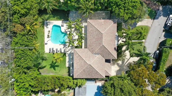 a view of a table and chairs in backyard