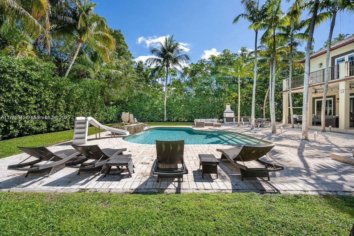 31 Island Drive Key Biscayne, FL 33149 - Photo 6 of 26 a view of a table and chairs in backyard