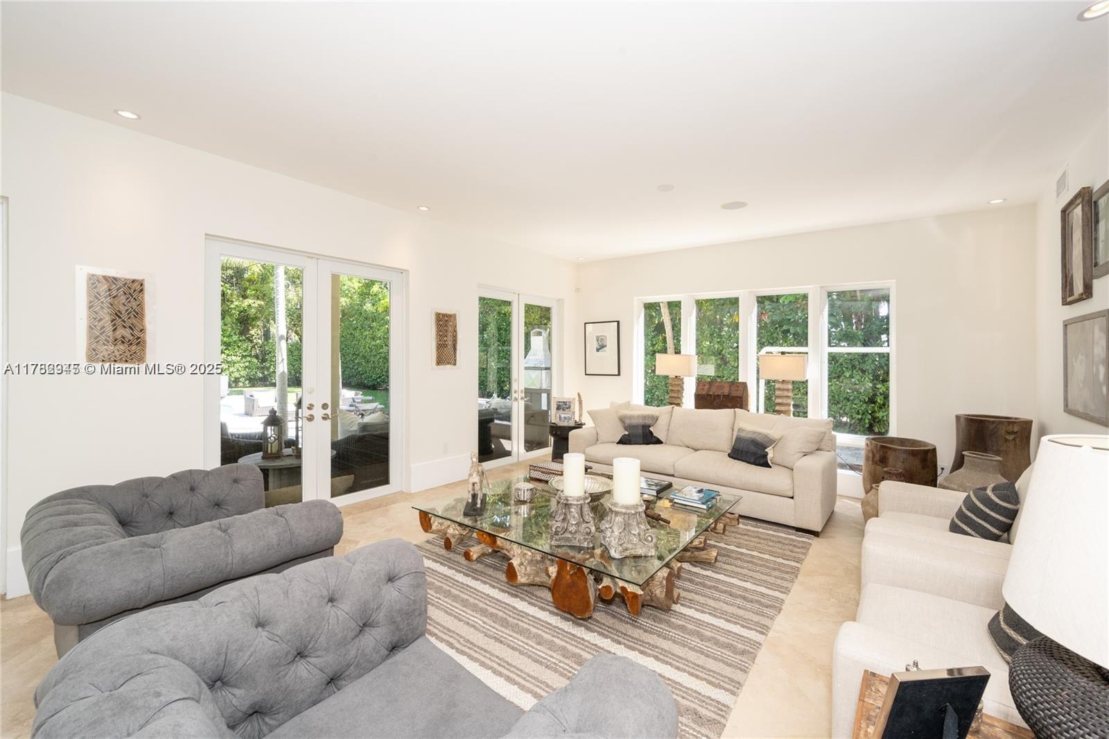 31 Island Drive Key Biscayne, FL 33149 - Photo 7 of 26 a living room with furniture large windows and wooden floor