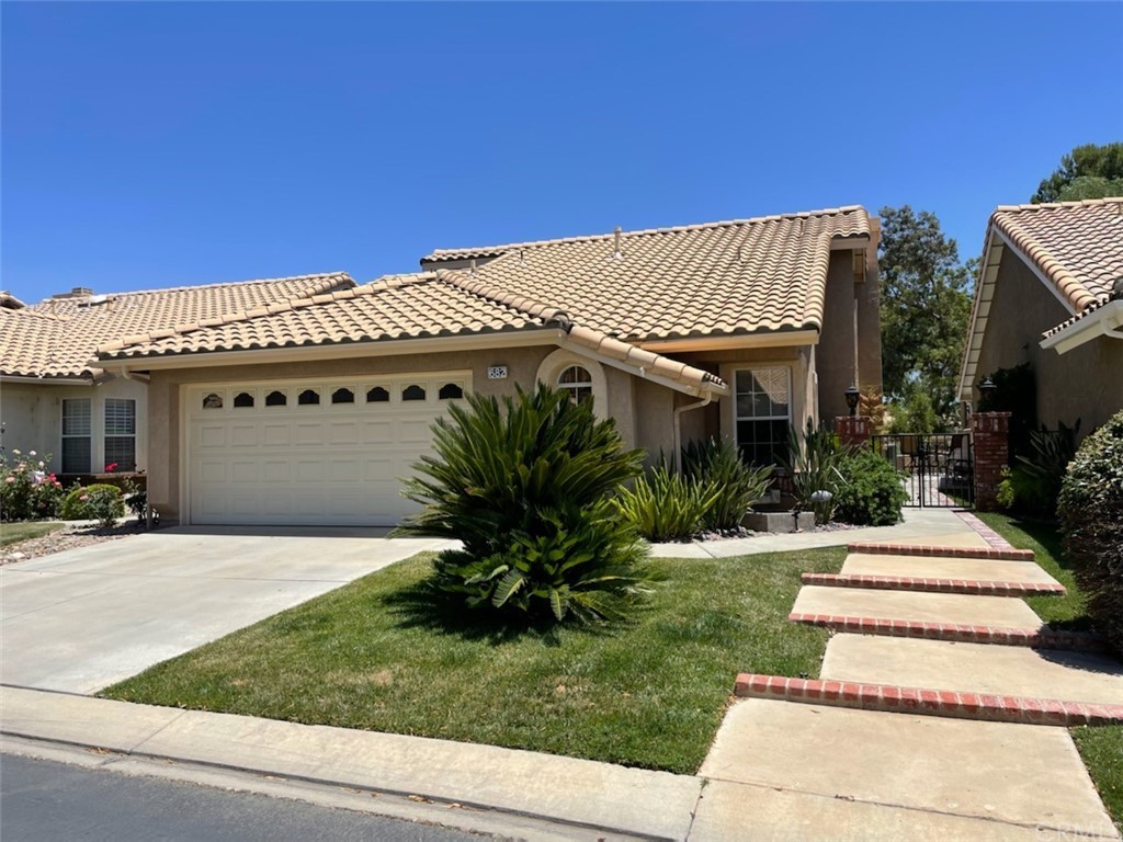 682 Pine Valley Road Banning, CA 92220 - Photo 1 of 1 a view of a house with a yard and potted plants