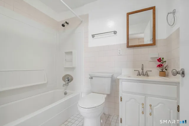 a bathroom with a sink toilet and a bathtub
