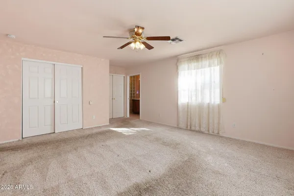 a view of an empty room with a window