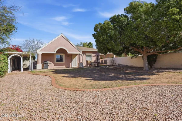 a view of a house with a yard