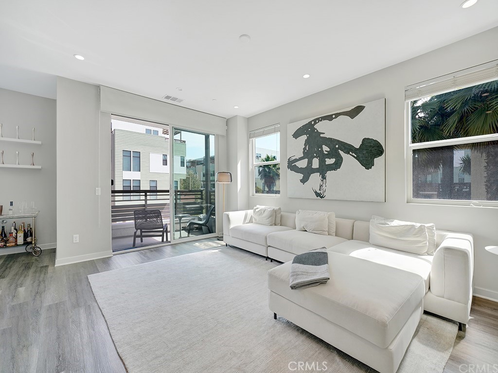 604 Malibu Costa Mesa, CA 92627 - Photo 14 of 40 a living room with furniture and a large window
