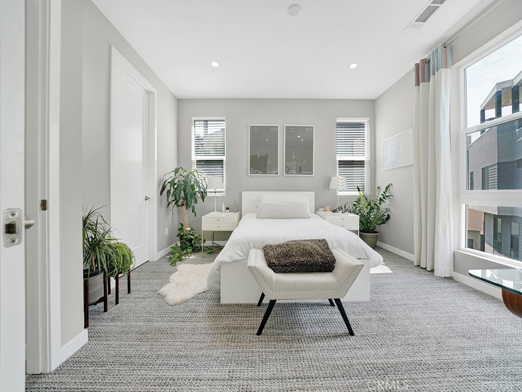 604 Malibu Costa Mesa, CA 92627 - Photo 23 of 40 a living room with furniture and a potted plant