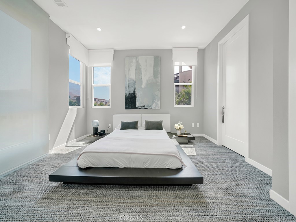 604 Malibu Costa Mesa, CA 92627 - Photo 25 of 40 a bedroom with a bed and window