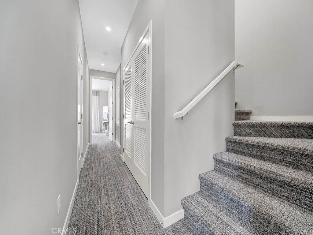 604 Malibu Costa Mesa, CA 92627 - Photo 27 of 40 a view of a hallway with wooden floor and entryway