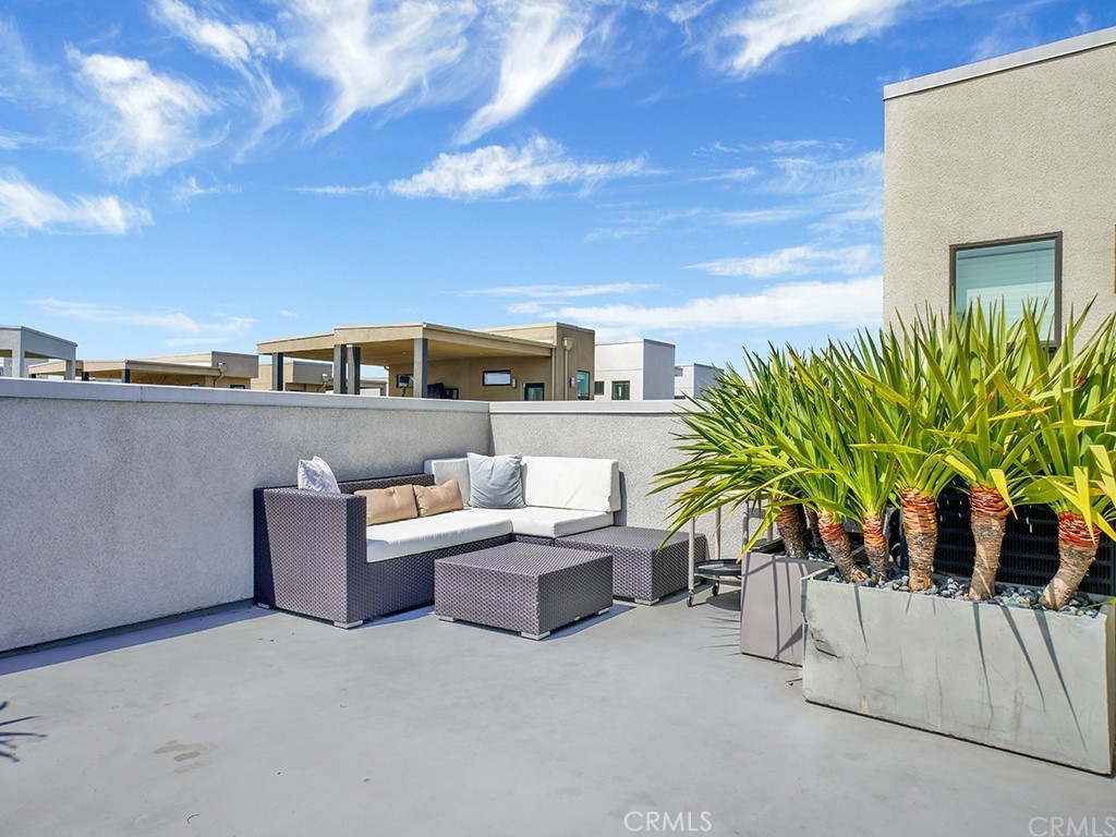 604 Malibu Costa Mesa, CA 92627 - Photo 35 of 40 a view of a terrace with couches and potted plants