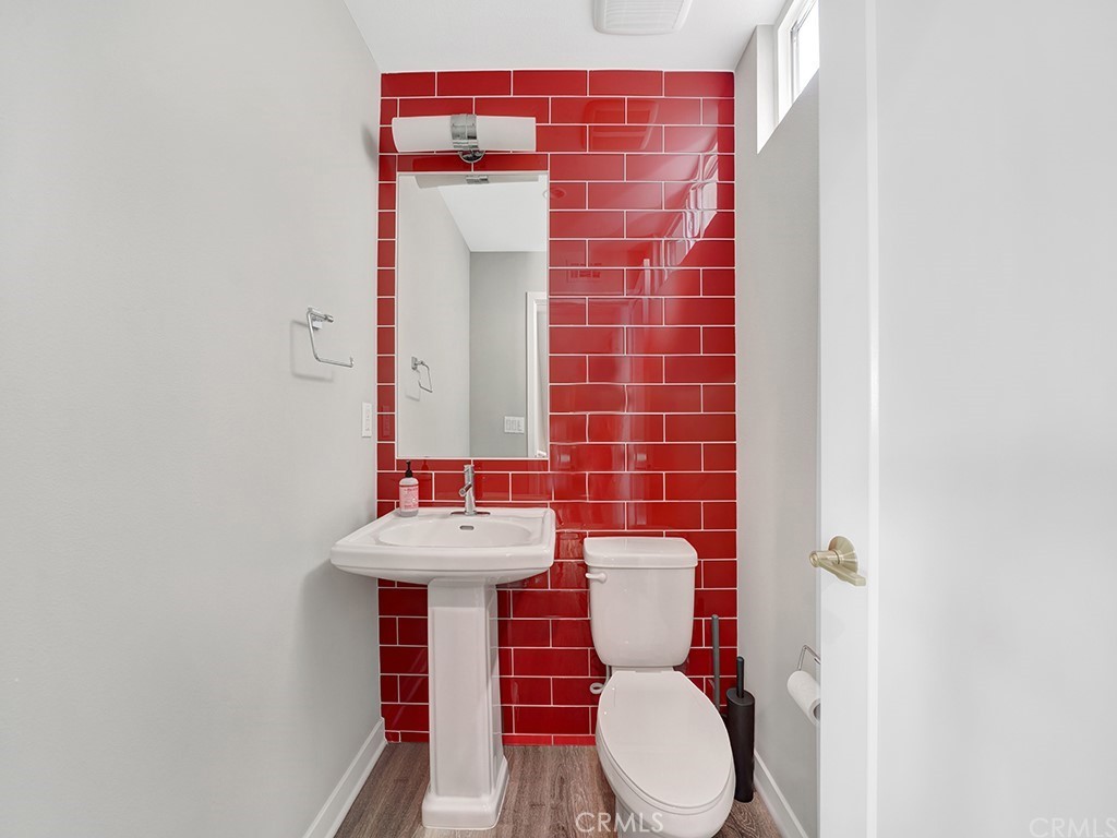 604 Malibu Costa Mesa, CA 92627 - Photo 5 of 40 a bathroom with a sink and a toilet