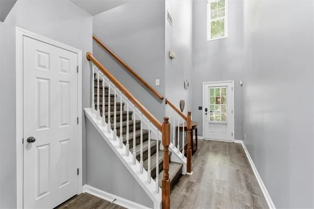 a view of an entryway with wooden floor