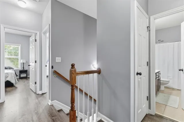 a view of a livingroom with wooden floor and windows