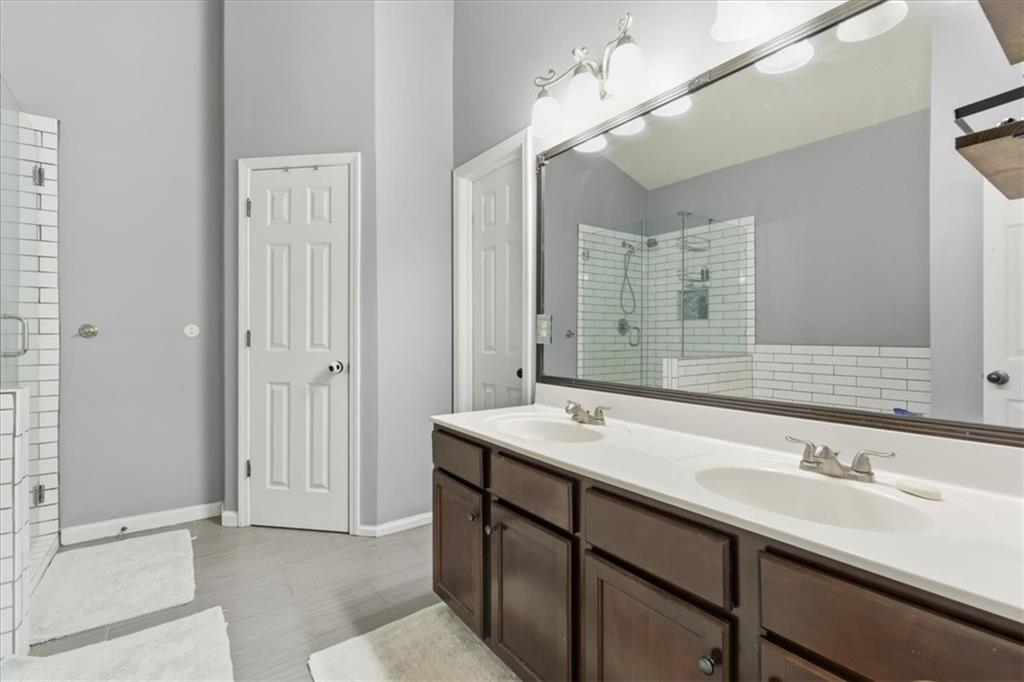 4349 Kousa Road, Unit 4 Austell, GA 30106 - Photo 18 of 43 a bathroom with a sink double vanity and a mirror