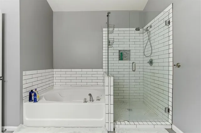 a bathroom with a shower and a bathtub