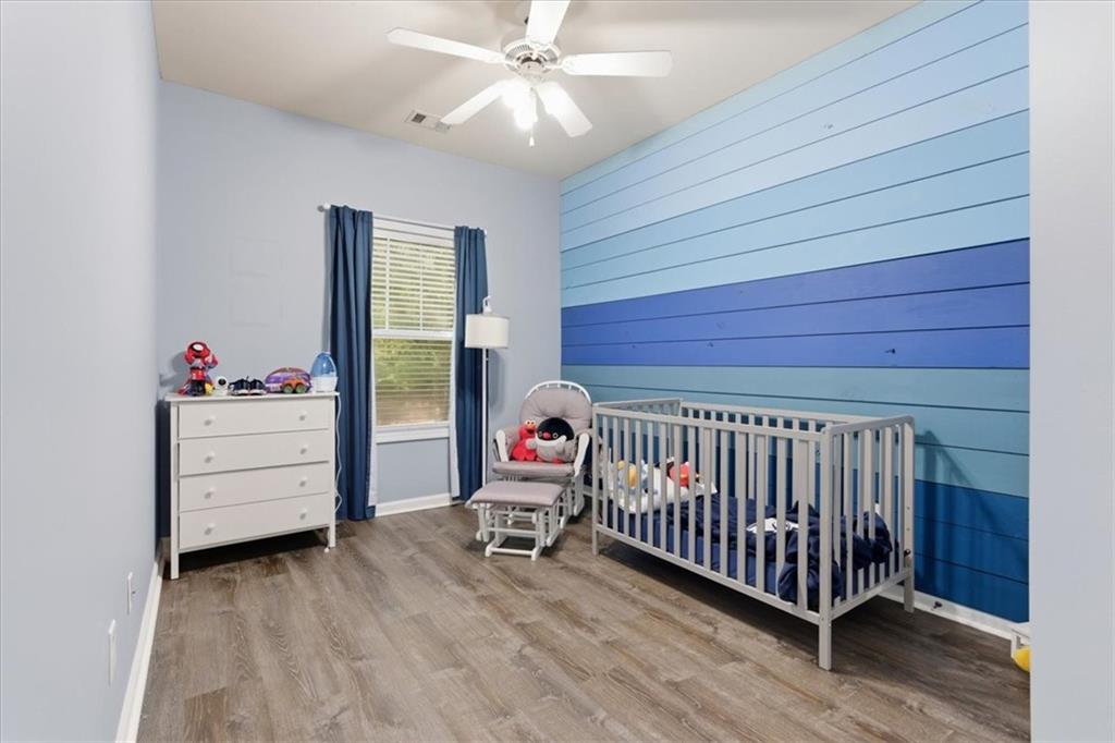 4349 Kousa Road, Unit 4 Austell, GA 30106 - Photo 21 of 43 a bedroom with bed and a chandelier