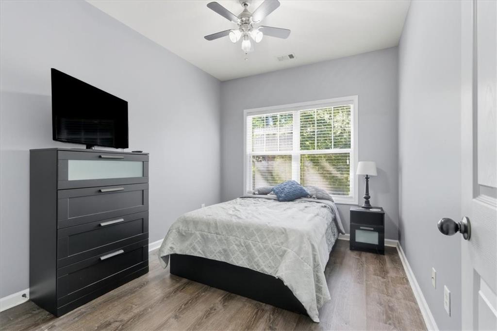 4349 Kousa Road, Unit 4 Austell, GA 30106 - Photo 22 of 43 a bedroom with a bed and a flat screen tv