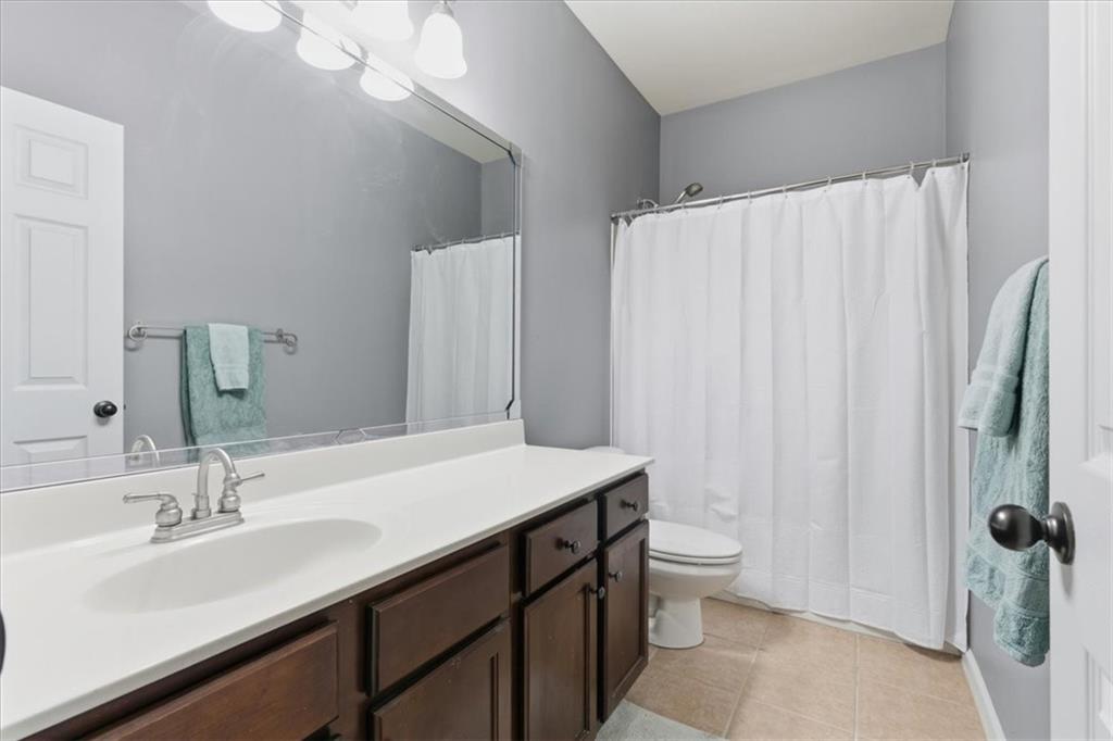4349 Kousa Road, Unit 4 Austell, GA 30106 - Photo 23 of 43 a bathroom with a sink a toilet and a large mirror