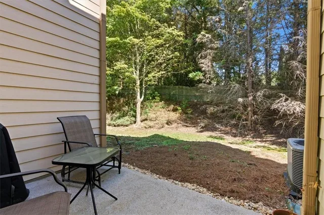 a backyard of a house with yard and outdoor seating