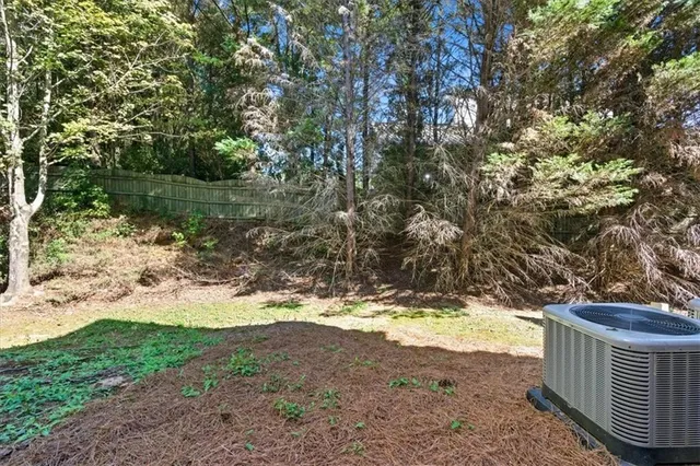 a view of a yard with a tree