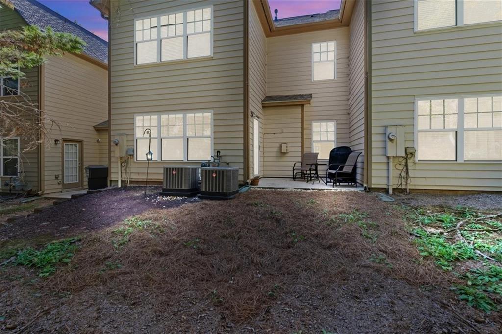 4349 Kousa Road, Unit 4 Austell, GA 30106 - Photo 29 of 43 a view of a house with backyard and sitting area