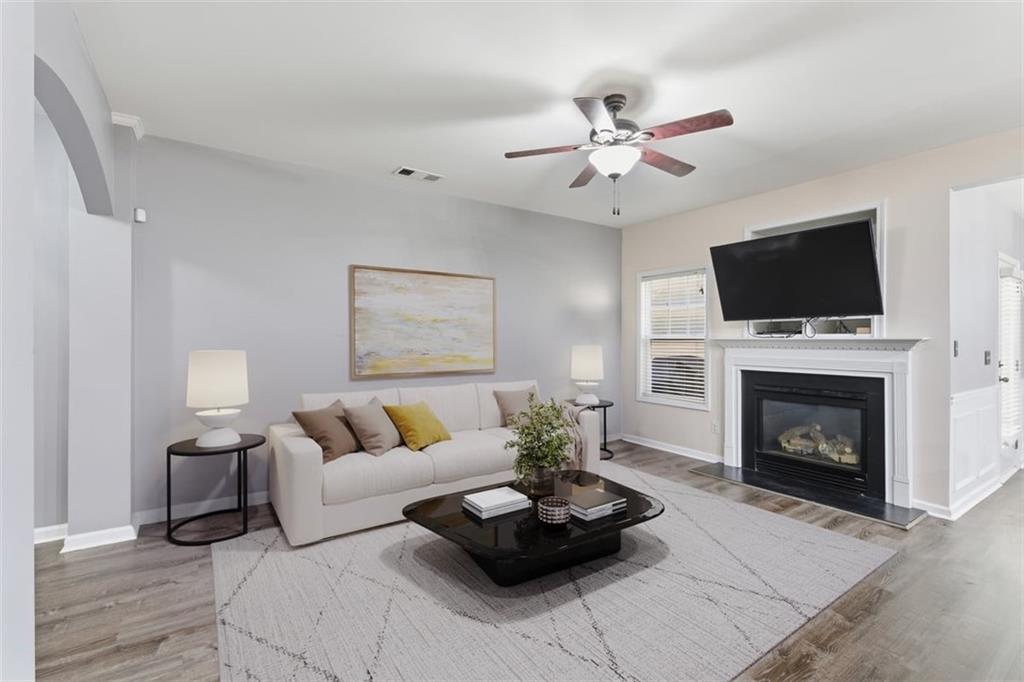 4349 Kousa Road, Unit 4 Austell, GA 30106 - Photo 3 of 43 a living room with furniture a fireplace and a flat screen tv