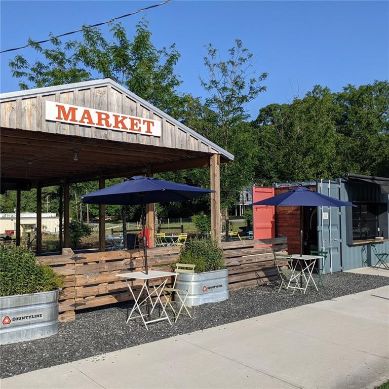 4349 Kousa Road, Unit 4 Austell, GA 30106 - Photo 37 of 43 a view of patio with table and chairs and potted plants
