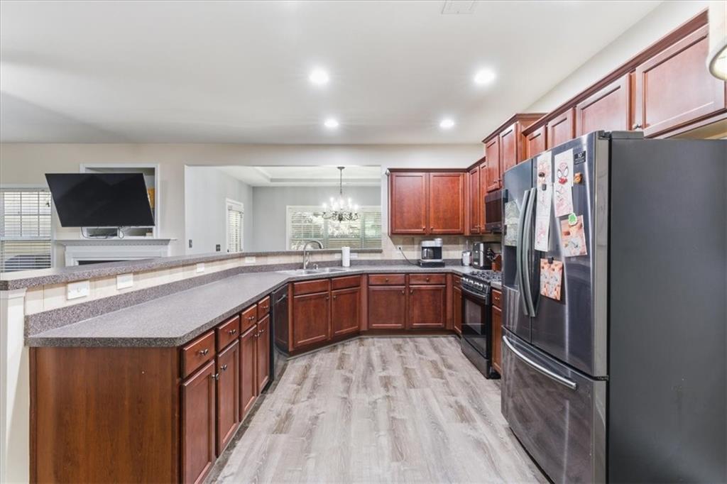4349 Kousa Road, Unit 4 Austell, GA 30106 - Photo 8 of 43 a kitchen with stainless steel appliances granite countertop a refrigerator and a stove top oven