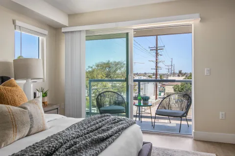 a bedroom with a bed and a window