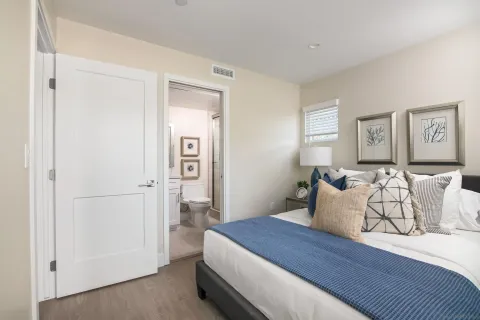 a bedroom with bed and window