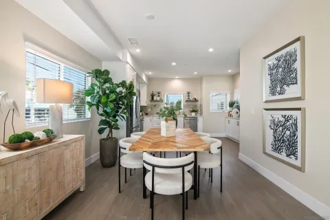 a dining room with furniture and window