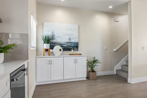 a hallway with a potted plant on the counter