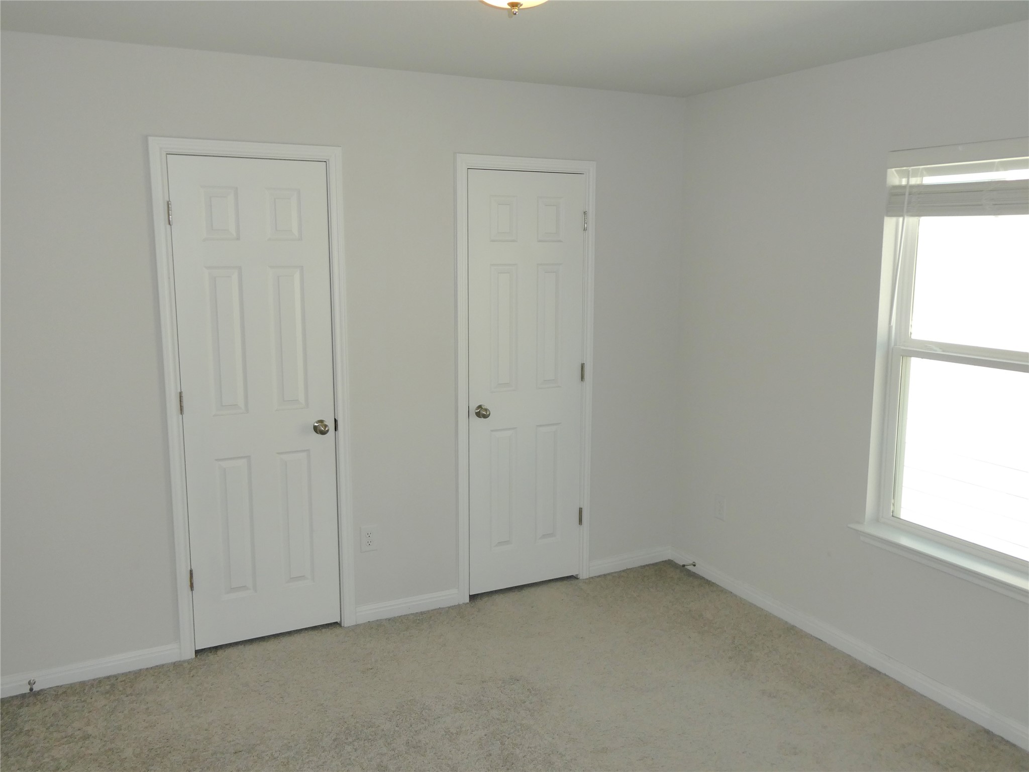 10906 Sentinel Drive Austin, TX 78747 - Photo 11 of 18 an empty room with windows