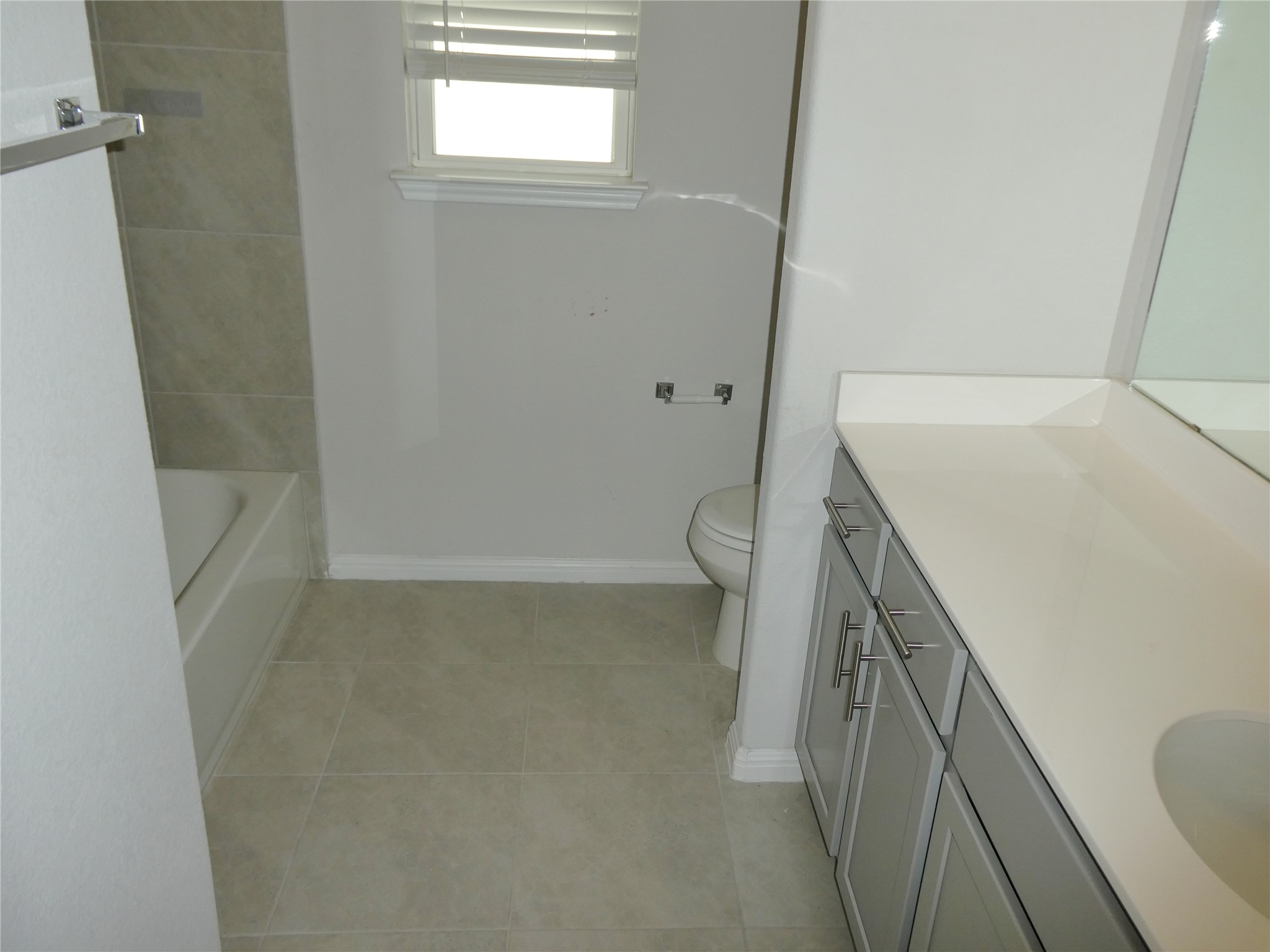 10906 Sentinel Drive Austin, TX 78747 - Photo 12 of 18 a bathroom with a sink a toilet and a shower