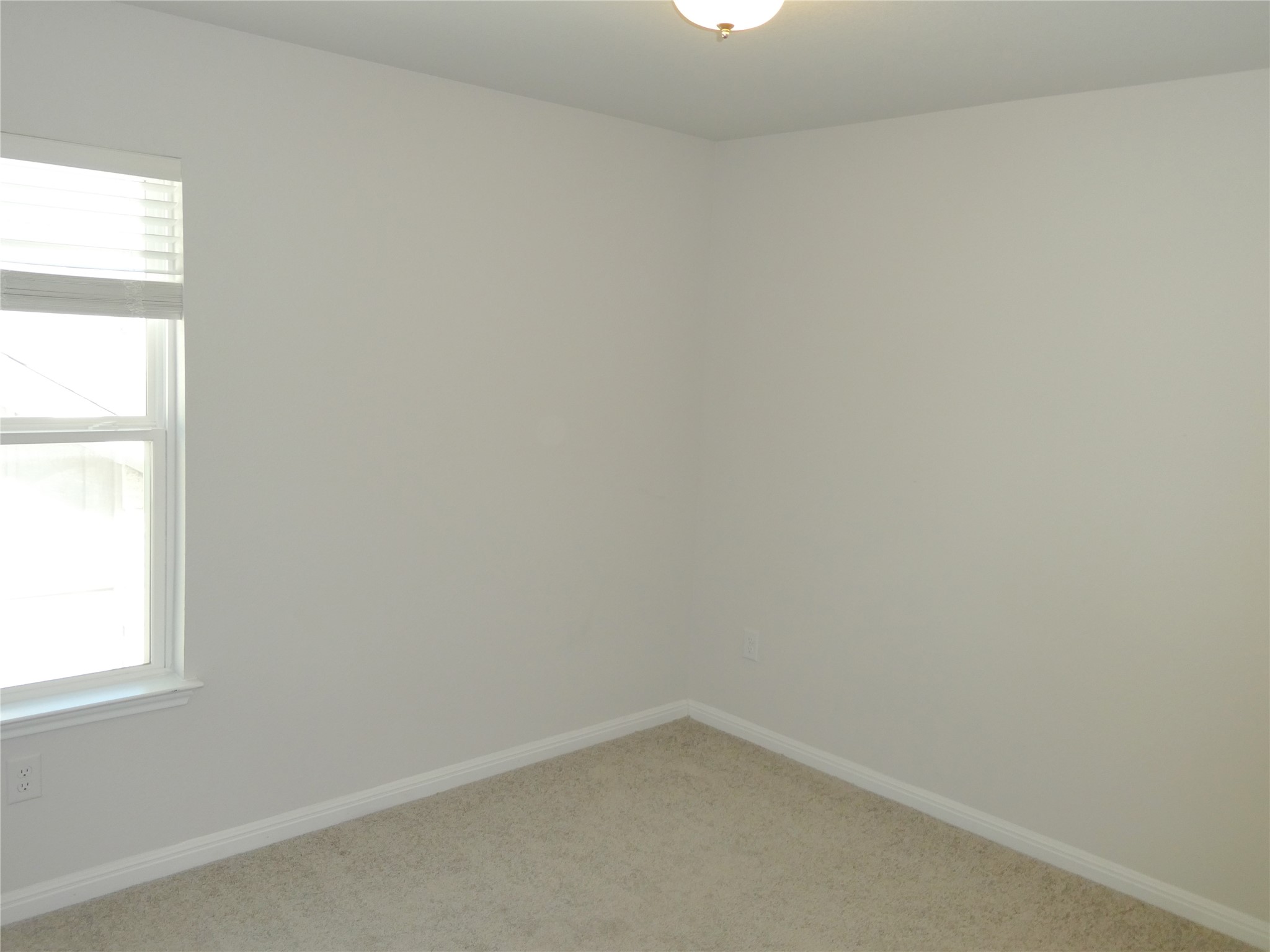 10906 Sentinel Drive Austin, TX 78747 - Photo 13 of 18 an empty room with a window