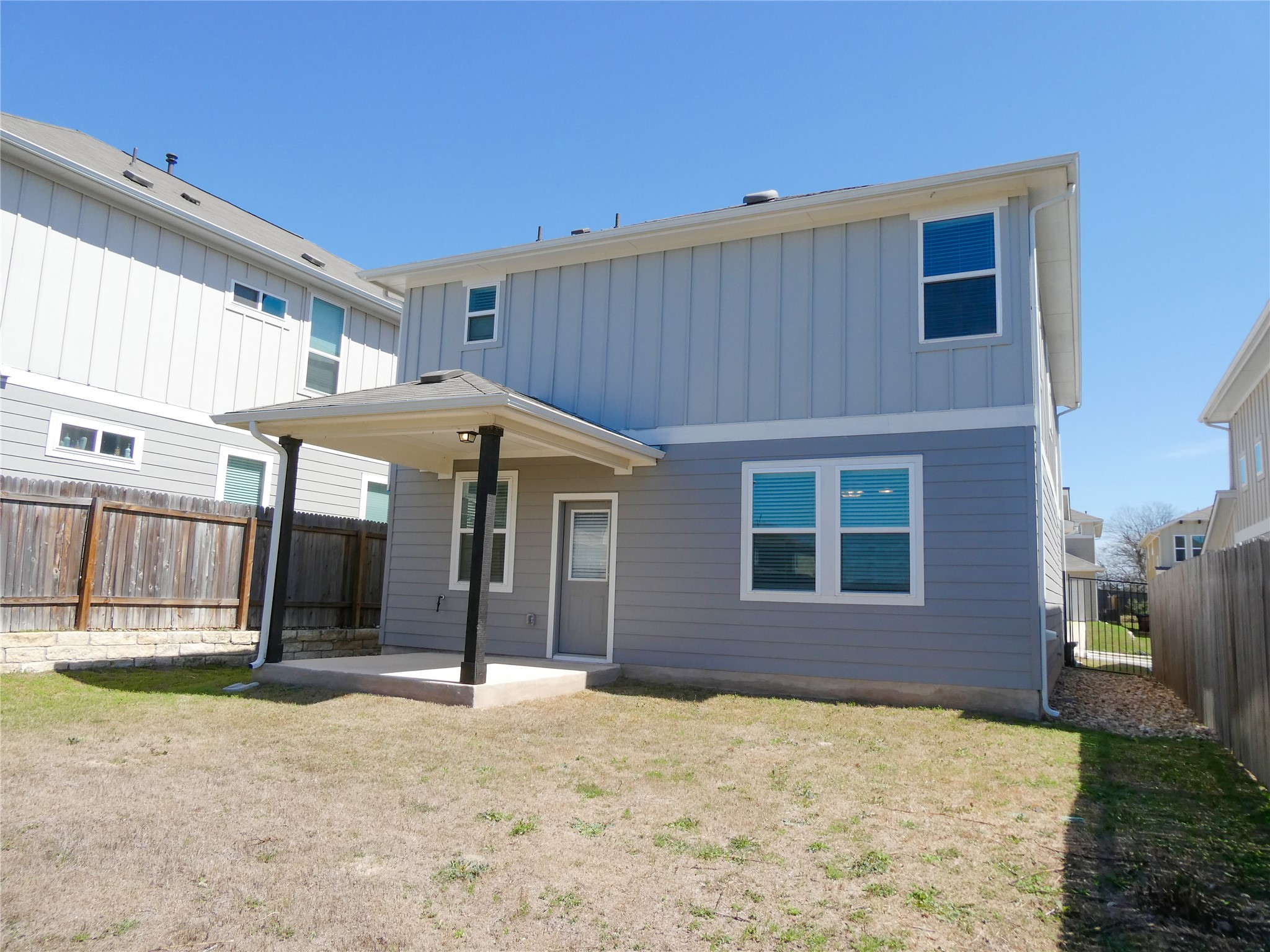 10906 Sentinel Drive Austin, TX 78747 - Photo 17 of 18 a front view of a house with a yard