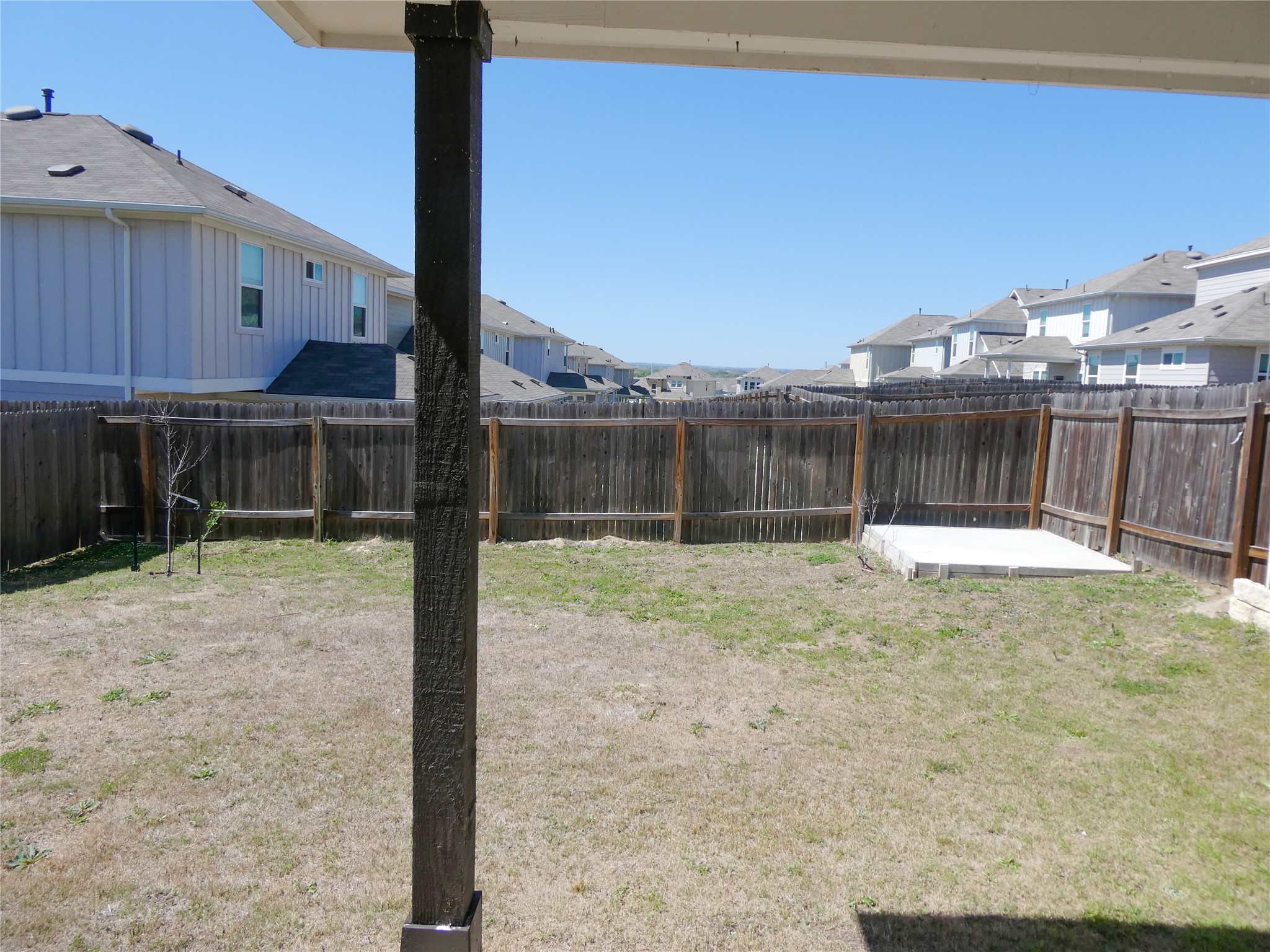 10906 Sentinel Drive Austin, TX 78747 - Photo 18 of 18 a backyard of a house with table and chairs