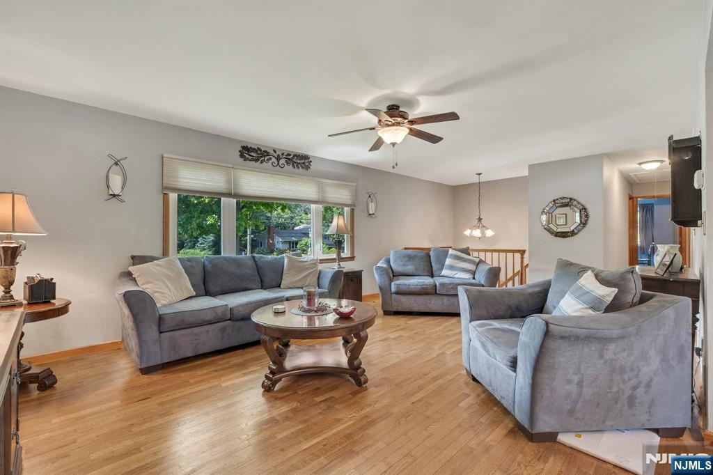55 Marcia Road Ringwood, NJ 07456 - Photo 10 of 42 a living room with furniture and a large window