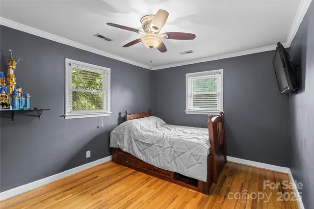 a bedroom with bed and window