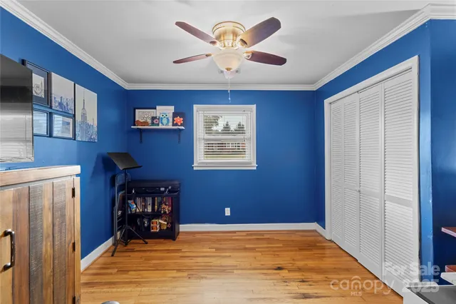 a view of workspace with window and a ceiling fan