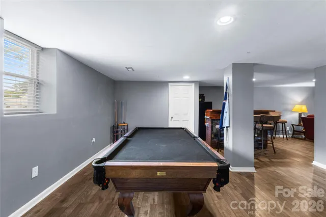 a room with furniture pool table and room