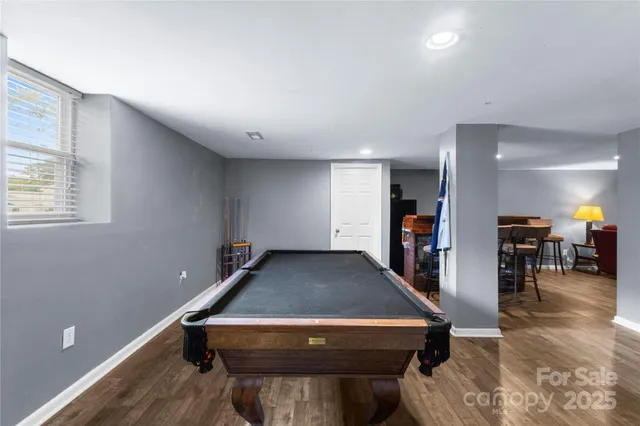 a room with furniture pool table and room