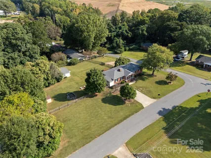a view of backyard with swimming pool