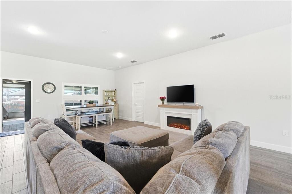 331 Cres Ridge Road Auburndale, FL 33823 - Photo 19 of 63 a living room with furniture and a fireplace