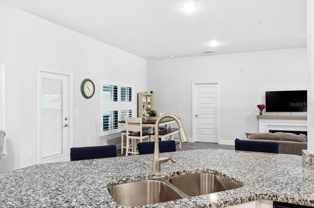 331 Cres Ridge Road Auburndale, FL 33823 - Photo 24 of 63 a kitchen with granite countertop a sink and a granite counter tops