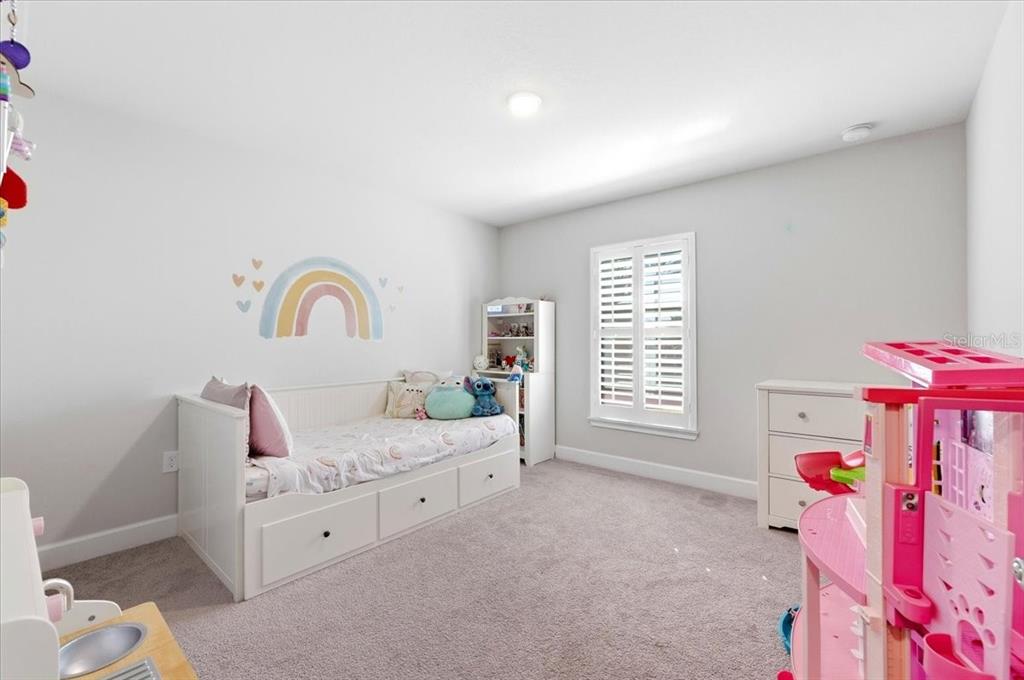 331 Cres Ridge Road Auburndale, FL 33823 - Photo 32 of 63 a bedroom with furniture and a window