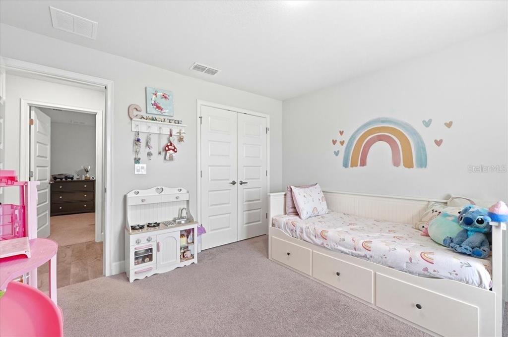 331 Cres Ridge Road Auburndale, FL 33823 - Photo 42 of 63 a bedroom with a bed and a potted plant