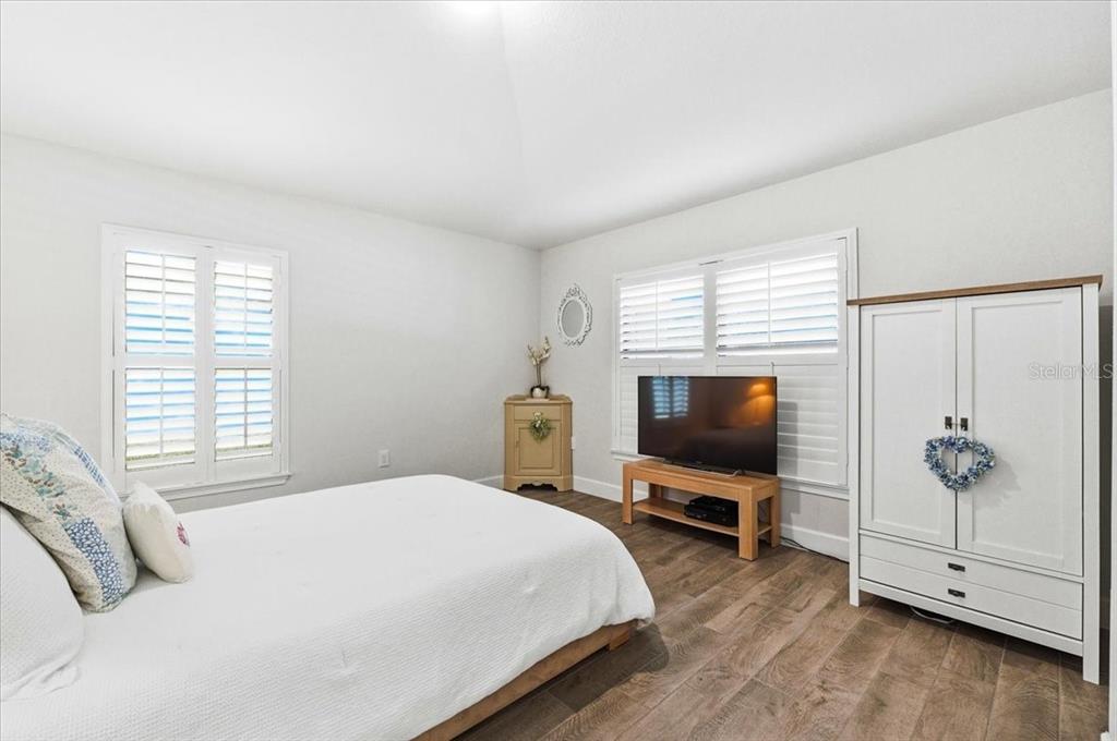 331 Cres Ridge Road Auburndale, FL 33823 - Photo 53 of 63 a bedroom with a bed and a flat screen tv